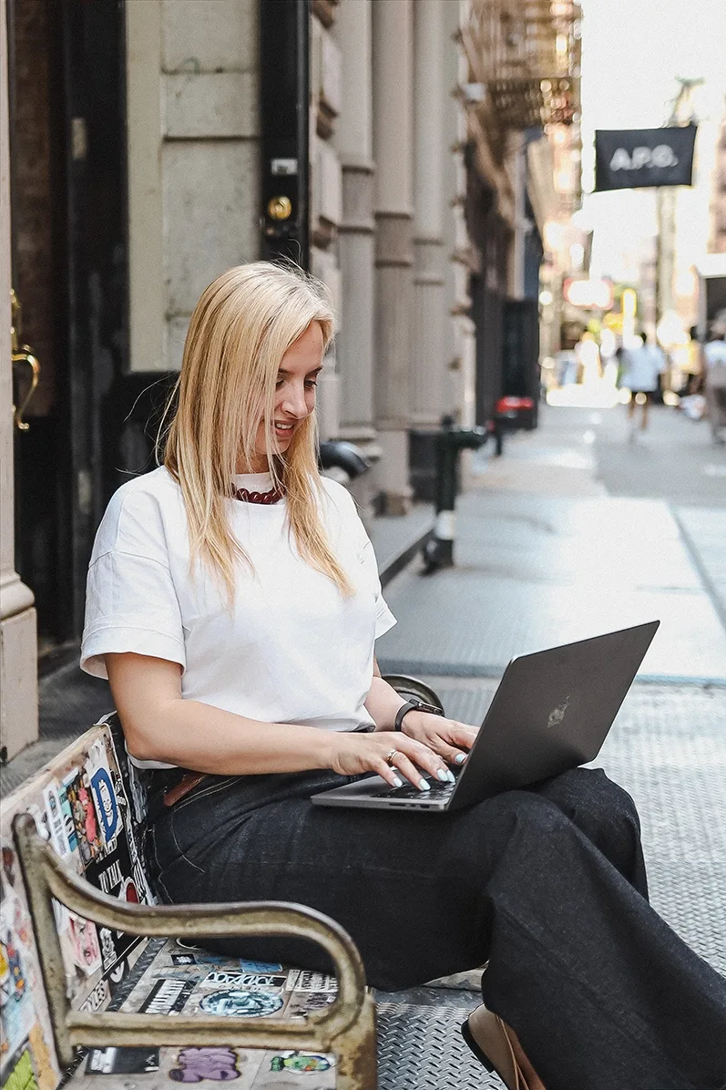 Maya Sayvanova writing on her laptop